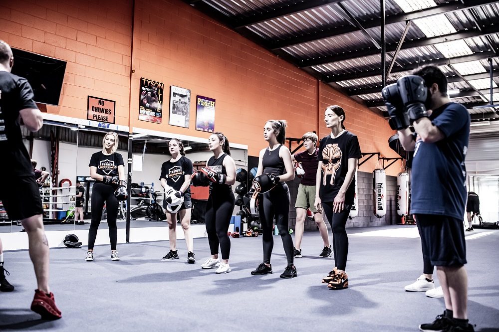 Adelaide Boxing Turner Gym A group of people standing in a gym.